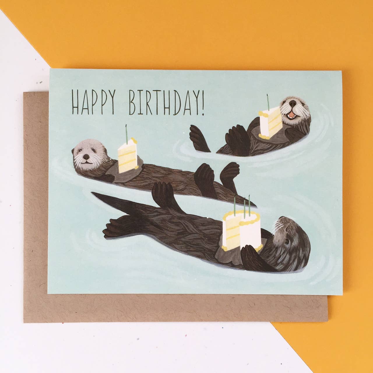 Otters Holding Cake Birthday Card